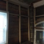Interior front wall showing lots of rot and damage