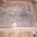 The right side of the original threshold. The former staircase covered this threshold, so it didn't need to be ground down
